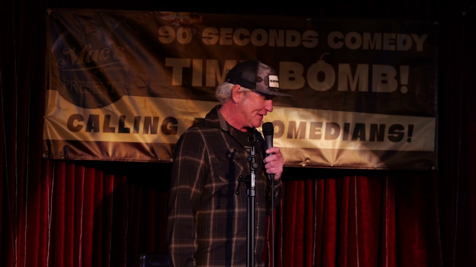 Comedian on stage during the live showcase